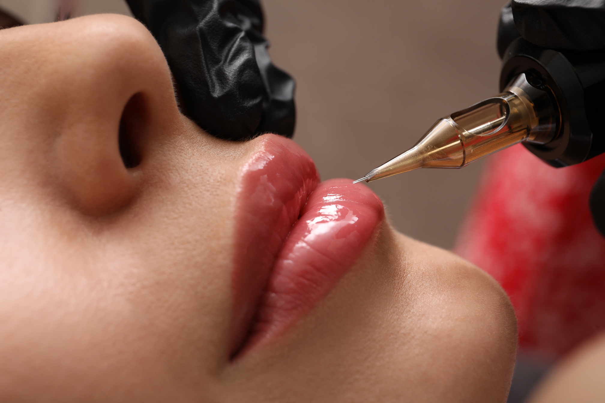 Young Woman Undergoing Procedure of Permanent Lip Makeup in Tatt